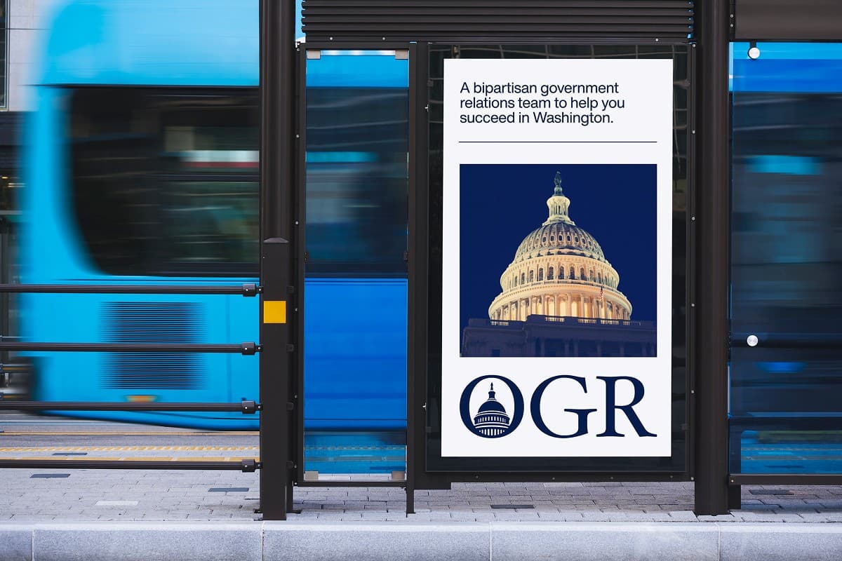 Bus shelter poster with the Capitol dome and the OGR logo, reading: A bipartisan government relations team to help you succeed in Washington.