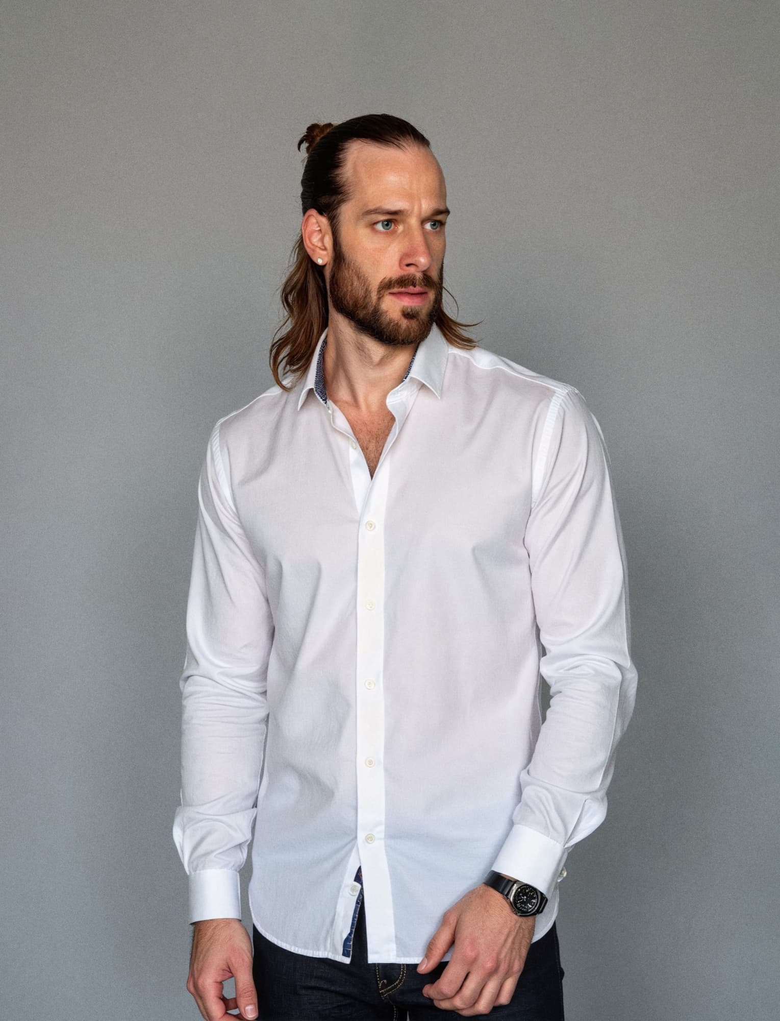 Christopher Hapner in a white shirt against a grey backdrop