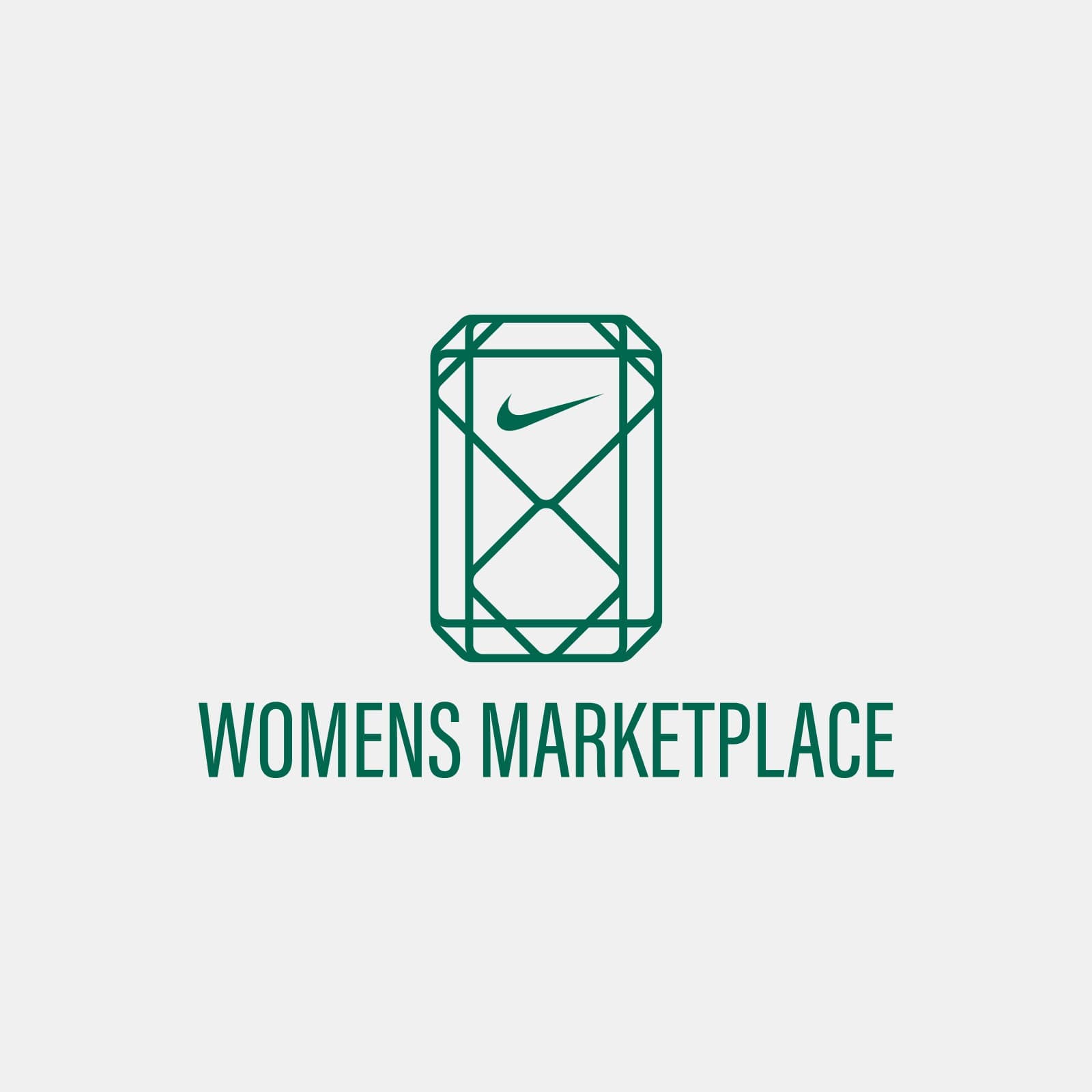 The Women's Marketplace logo: the gemstone mark above the name, in emerald green
