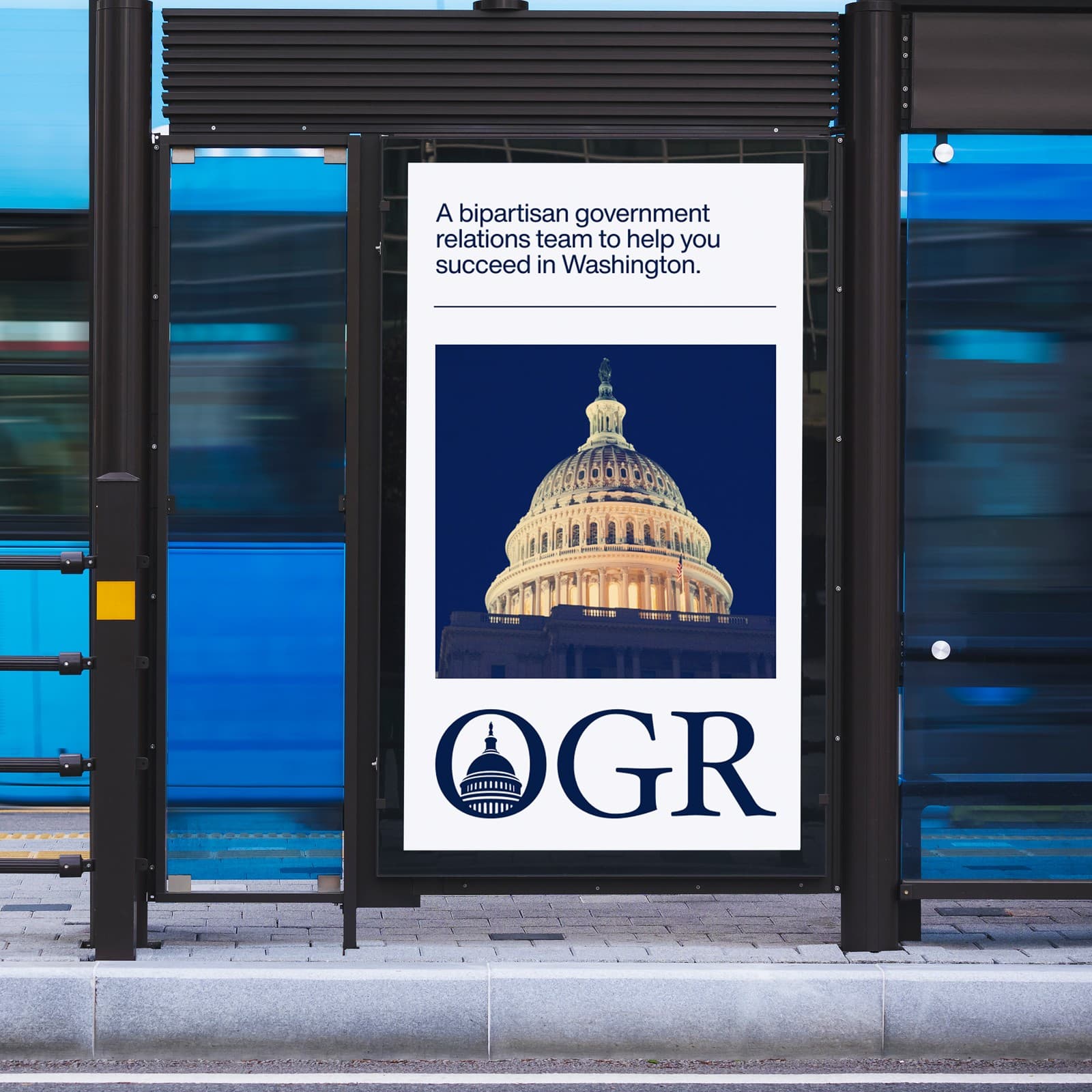OGR bus shelter poster with the Capitol dome at dusk